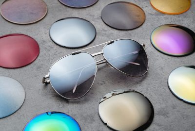 Closeup of assortment of different colored optical corrective lenses for eyewear, fashion trendy sunglasses for eyes protection from sun. Eyesight concept